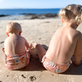 LITTLE E & CO – kids swim nappy, a pale pink with a colourful Australian animals print featuring koalas, kangaroos, platypus, kookaburras and echidnas. The swim nappy is a one size fits most design and has 3 adjustable snap settings.