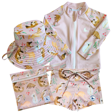 LITTLE E & CO - four-piece kids' swim set featuring a long-sleeve rash guard, swim hat, swim shorts and wet bag. The set is a pale pink with a colourful Australian animals print featuring koalas, kangaroos, platypus, kookaburras and echidnas. Made with UPF 50+ sun protection fabric. The rash guard has a front zipper for easy wear, and the shorts feature an adjustable drawstring waistband for a secure fit, and the hat has adjustable toggles.