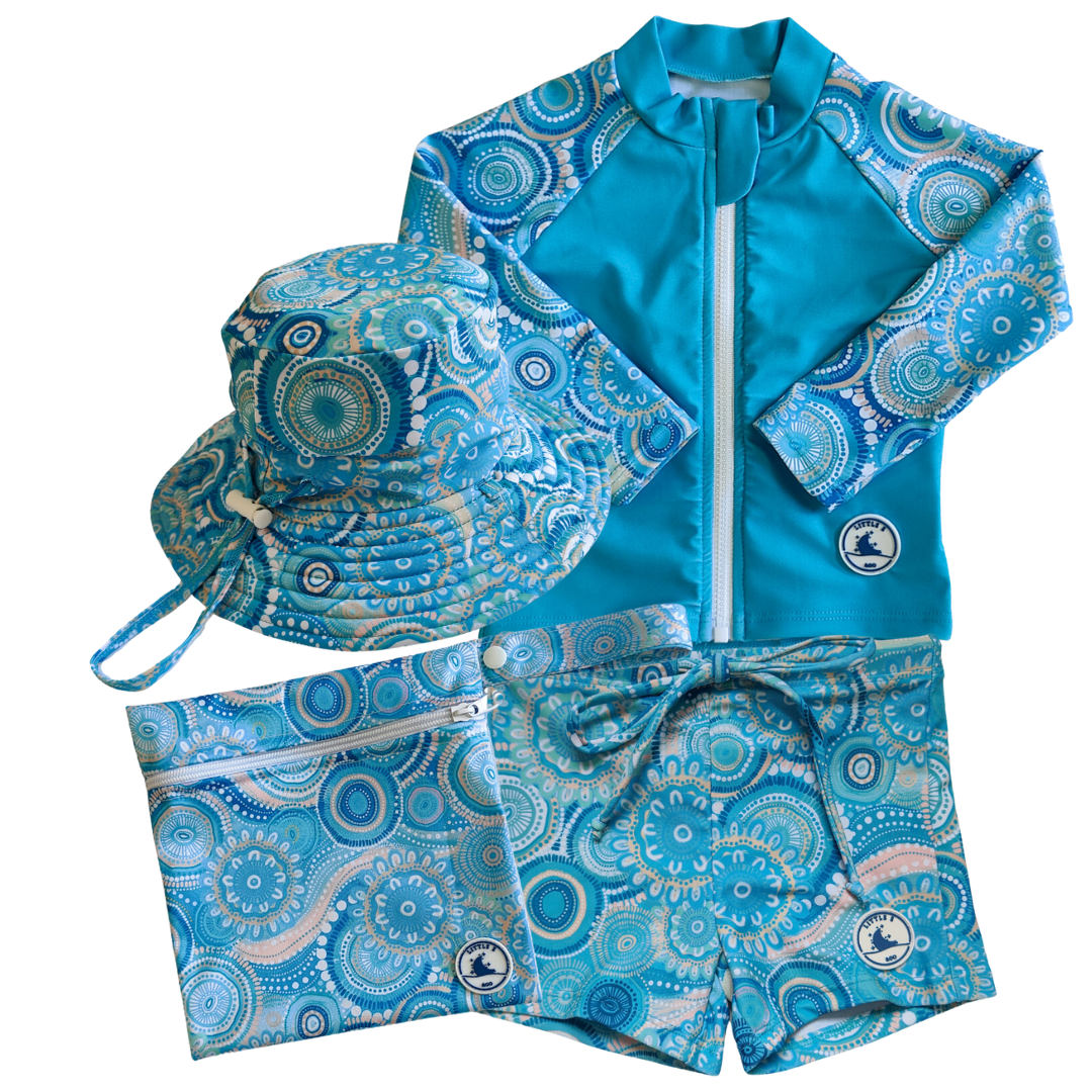 LITTLE E & CO - four-piece kids' swim set featuring a long-sleeve rash guard, swim hat, swim shorts and wet bag. The set is a turquoise blue with a colourful contemporary indigenous print. Made with UPF 50+ sun protection fabric. The rash guard has a front zipper for easy wear, and the shorts feature an adjustable drawstring waistband for a secure fit, and the hat has adjustable toggles.
