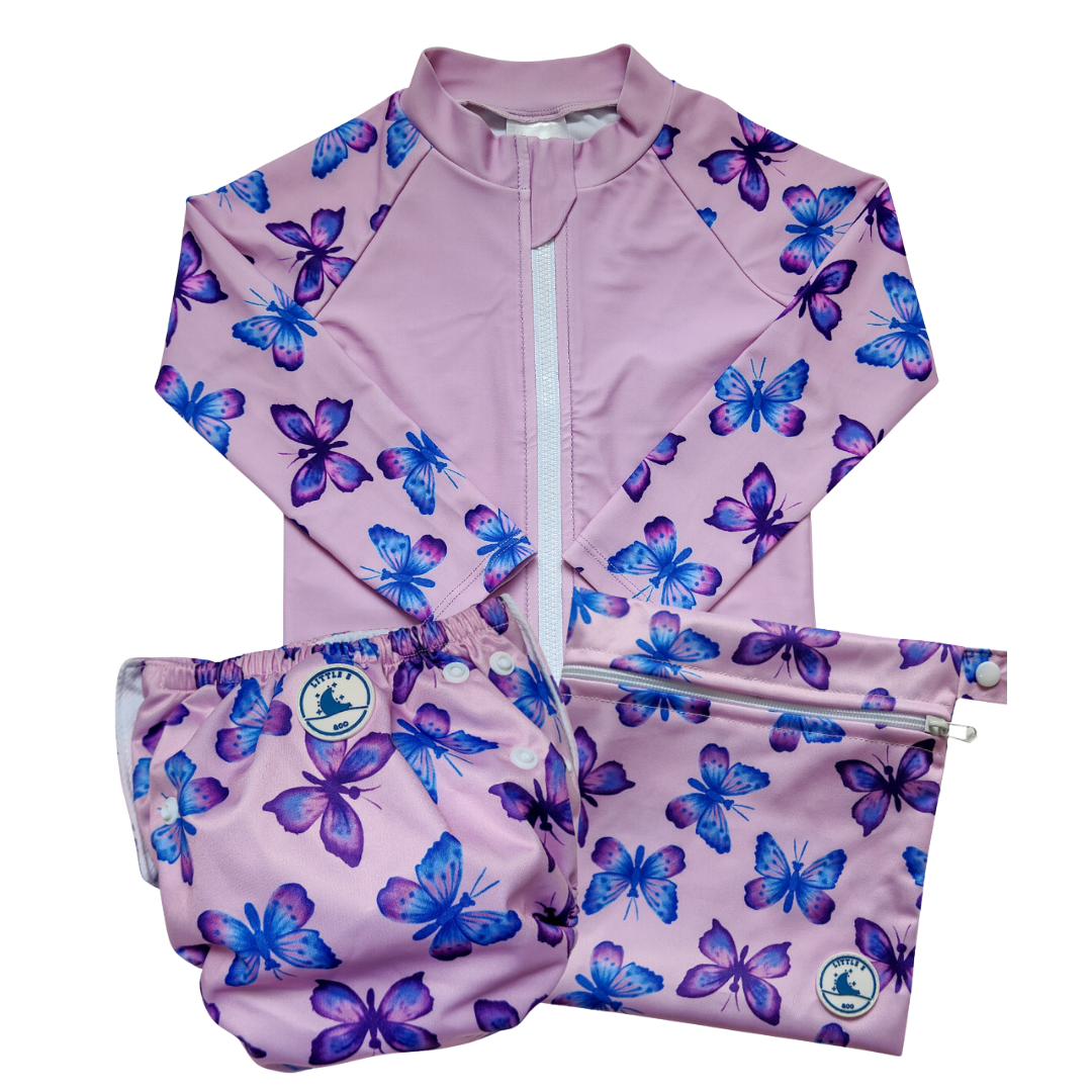 Baby swimwear set in butterflies print with long sleeve rashie, reusable swim nappy, and wet bag. UPF 50+ fabric.