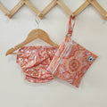 Swim Nappy and Wet Bag in matching Indigenous print featuring adjustable snaps and waterproof fabric.