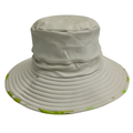 Beige bucket hat with green floral pattern on a white background