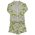 Children's swimsuit with green crocodile pattern on a beige background