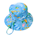 LITTLE E & CO – kids swim hat, a blue with a colourful ocean print featuring whales, turtles, fish and coral. Made with UPF 50+ sun protection fabric. The swim hat features adjustable toggles.