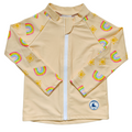 LITTLE E & CO – kids long-sleeve rash guard, a pale yellow with a colourful rainbow and sun print. Made with UPF 50+ sun protection fabric. The rash guard has a front zipper for easy wear.