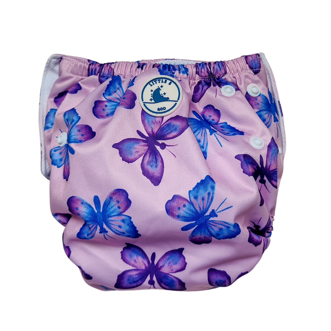 LITTLE E & CO – kids swim nappy, a pastel purple with a colourful pink, blue and purple butterflies. The swim nappy is a one size fits most design and has 3 adjustable snap settings.