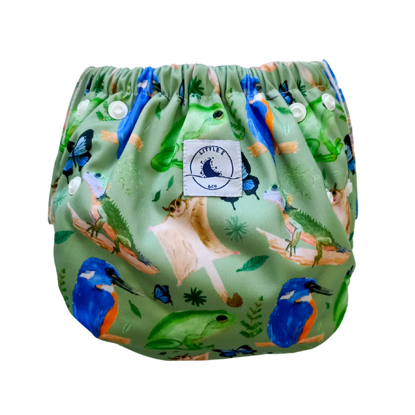 Reusable swim nappy in Forest print featuring birds, frogs, lizards and butterflies