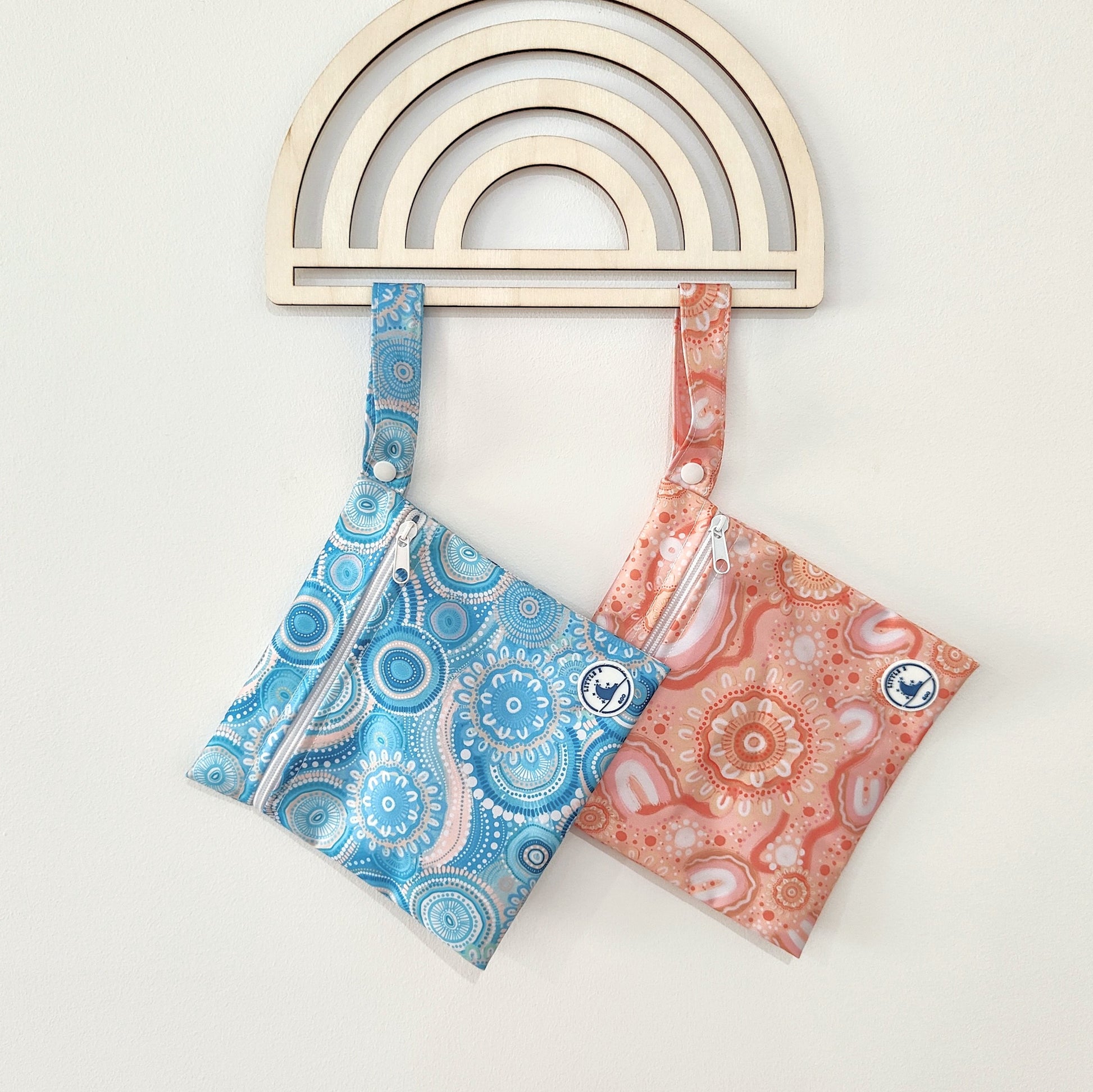 Mini wet bag with fun, colourful print, made from waterproof PUL and features a handy strap.


